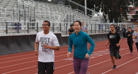 Seniors JC Lara and Emma O’Hara run together at track and field practice, a coed sport, Thursday, March 2. 