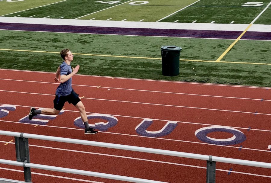 Junior, John Horan running in track. Running with passion is helpful for miles, though many teens lack determination.