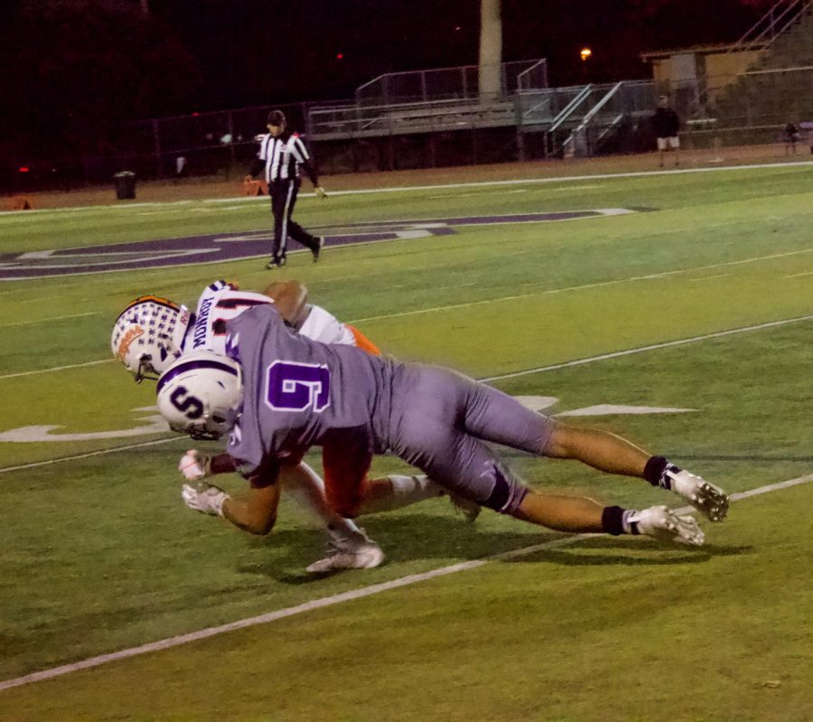 Cornerback Steven Stone makes a tackle in the backfield