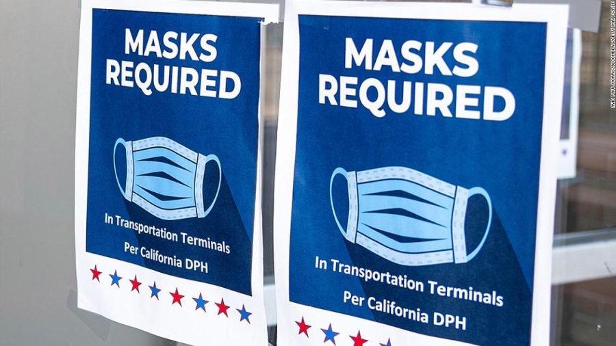 Signs inform visitors that masks are required inside the Ferry Building in San Francisco, California, U.S., on Monday, July 19, 2021. Officials in the San Francisco area are recommending that residents wear masks again indoors in public places regardless of vaccination status. Photographer: David Paul Morris/Bloomberg